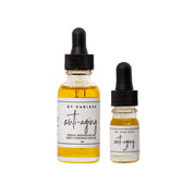 Anti-Aging Facial Oil, 1 oz dropper bottle next to the 5 mL sample size
